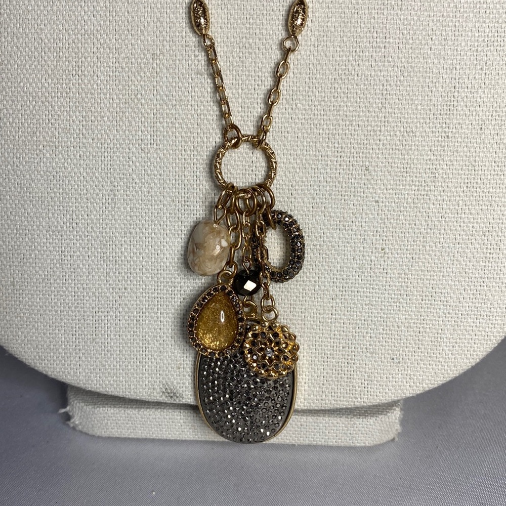 Beautiful long Goldtone charm style necklace